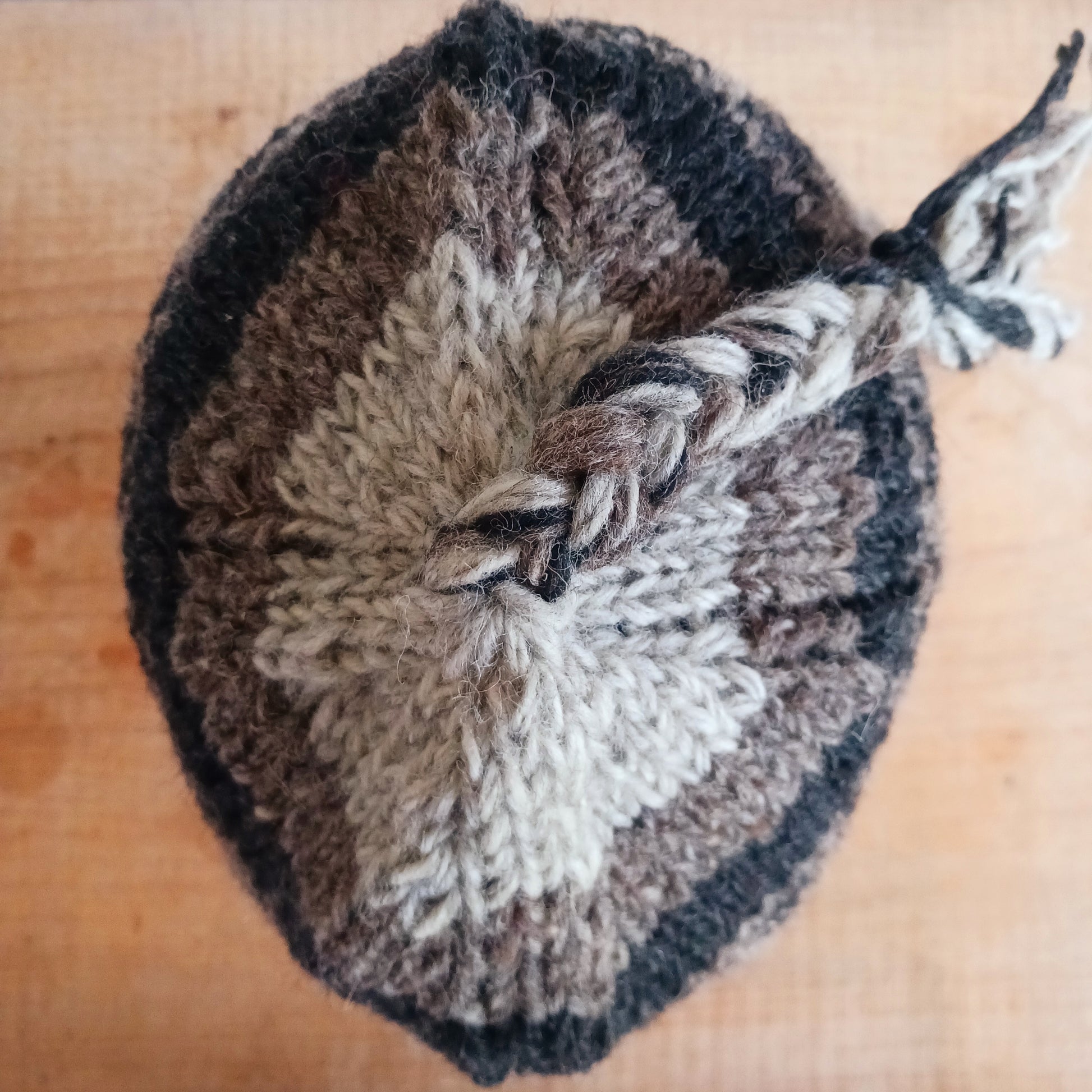 Stay cozy and stylish with our handmade chunky wool earflap hats, crafted in Nepal by skilled women artisans in Kathmandu. Each hat is 100% pure wool and features a soft polar fleece lining for extra warmth and comfort. Perfect for cold winter days, outdoor adventures, or adding a touch of handmade charm to your look.