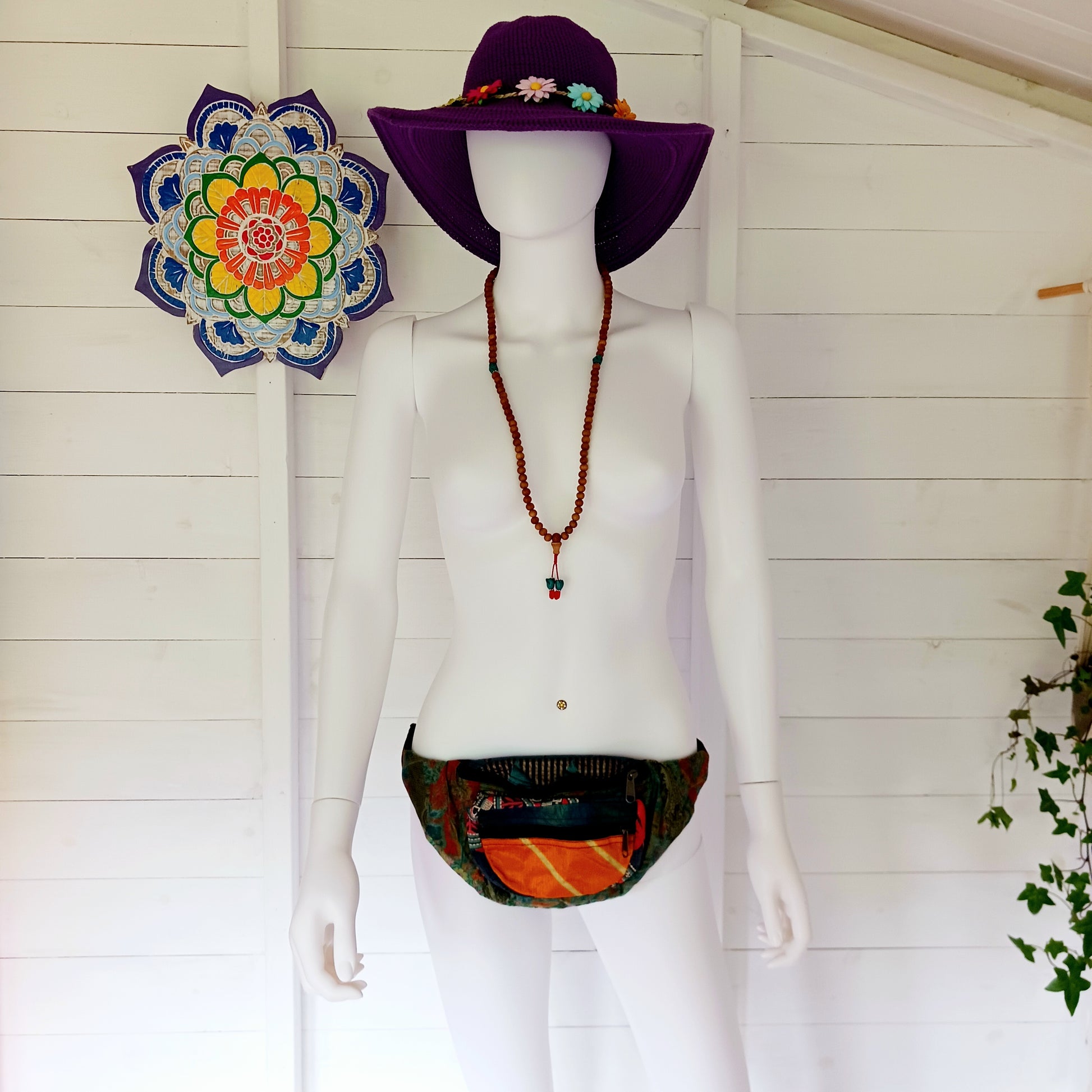 A fun style bum bag made from a patchwork of pretty sari materials. The waistband is adjustable and there is an extra secure zip compartment for easy access. This bag can also be worn across the body for extra security.
