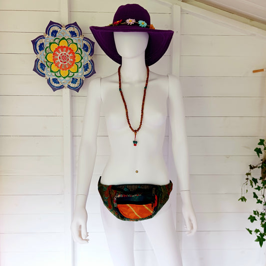 A fun style bum bag made from a patchwork of pretty sari materials. The waistband is adjustable and there is an extra secure zip compartment for easy access. This bag can also be worn across the body for extra security.