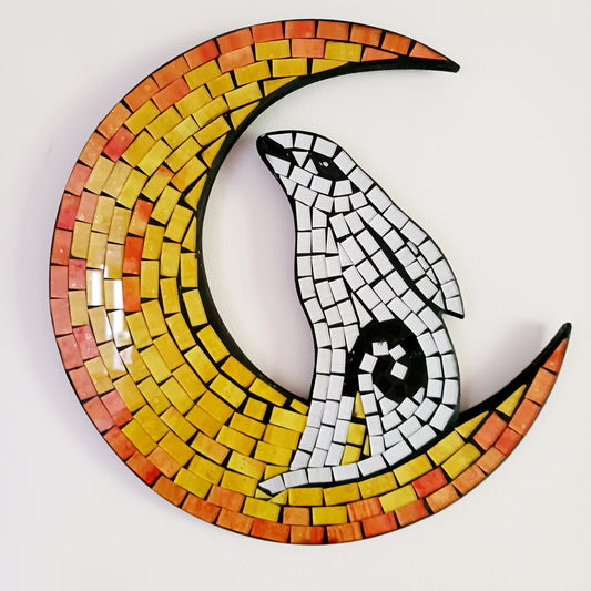 Add a touch of whimsy to your home décor with this enchanting handcrafted wall hanging. Featuring a vibrant yellow mosaic crescent moon and a serene white hare, this unique plaque is a striking statement piece for any room. Perfect for bohemian, mystical, or nature-inspired interiors, it makes a thoughtful gift or a distinctive addition to your own collection.