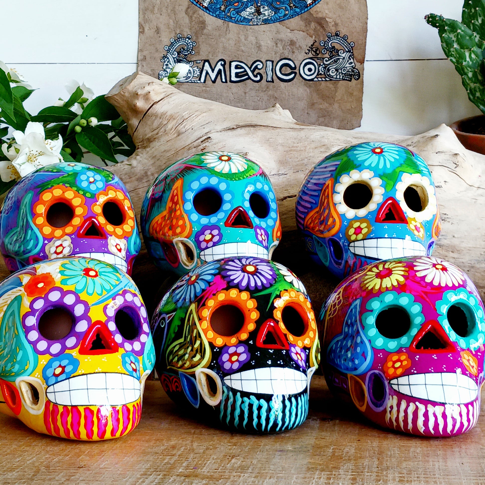 These fun ceramic sugar skull ornaments have been beautifully painted in bright colours and finished with a high shine glaze.  They are a popular item during Día de Los Muertos or Day of the Dead festivities, held in Mexico every November to celebrate welcoming the souls of their deceased relatives back for a time of food, drink and celebration.
