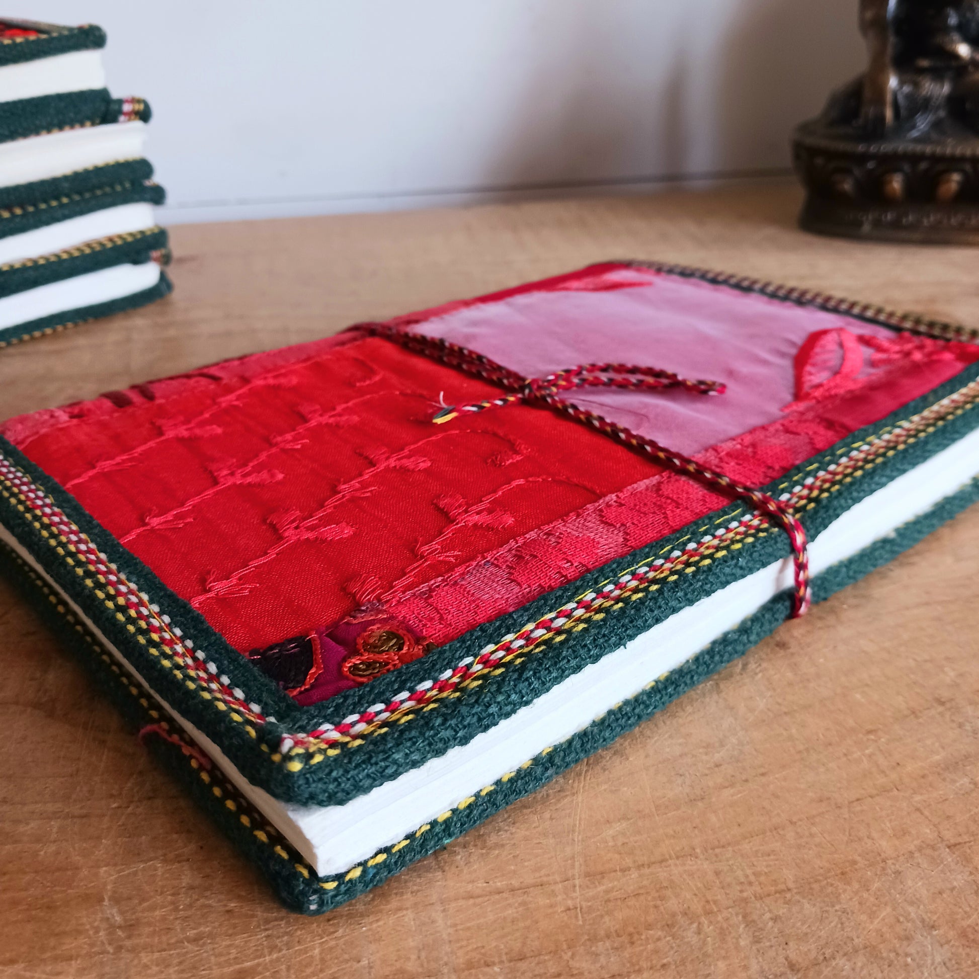This beautifully bound notebook with handmade paper is from recycled cotton. An imaginative use for sari offcut material, the cover is edged and framed with pretty brocade material to complete a lovely and unique eco friendly stationery gift.