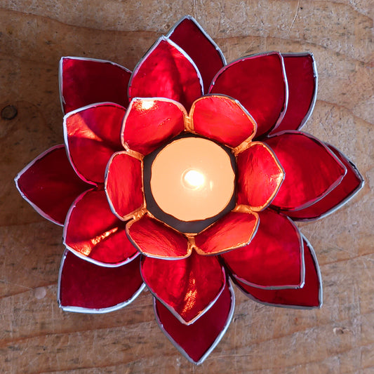 The Lotus Flower is a symbol of achieving enlightenment, peacefulness and spirituality. This beautiful candle holder can be fitted with tealight candles or slightly larger candles. The diameter of the middle is roughly 5.5cm, so it will fit any candle with the same diameter.