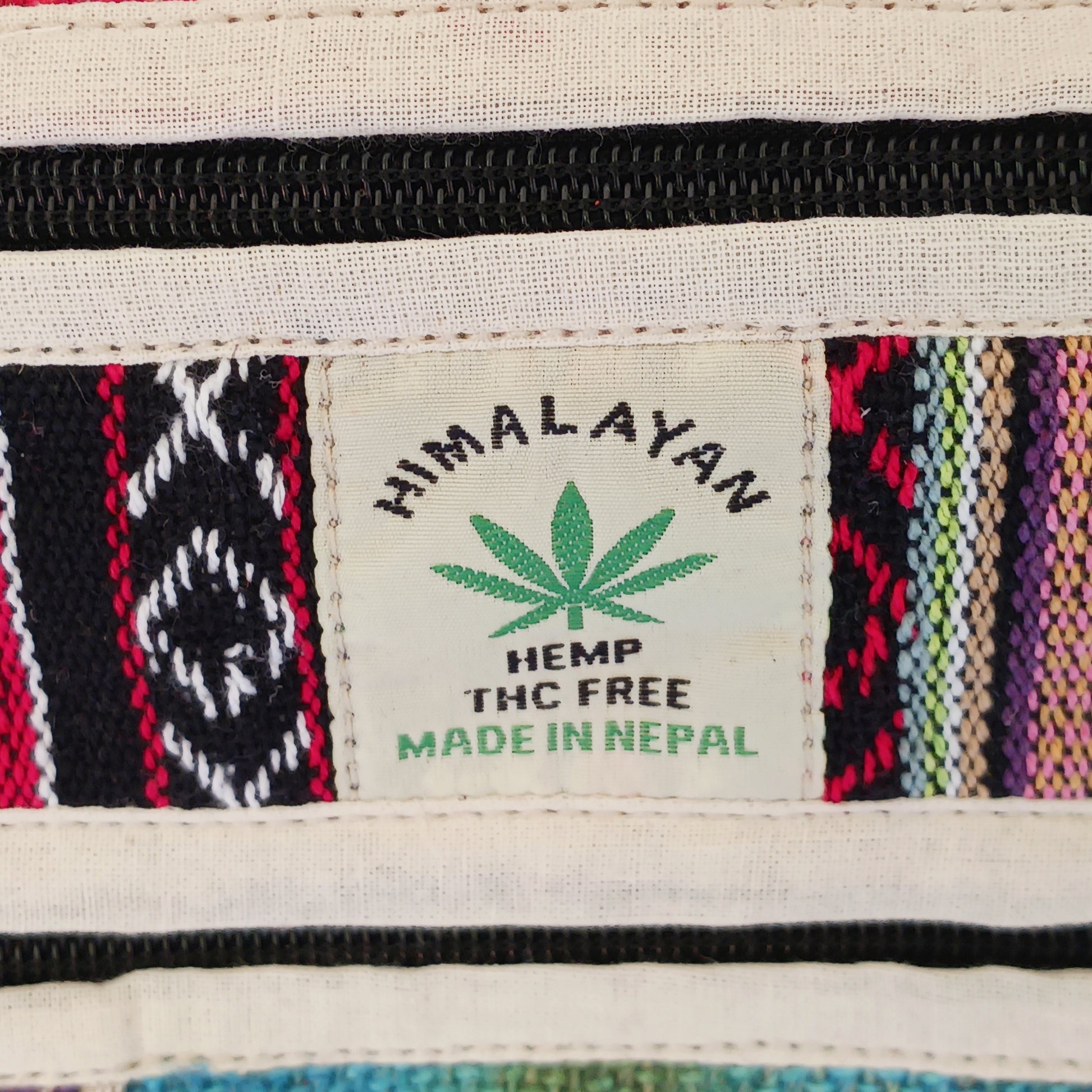 This is such a fantastic and handy messenger bag or satchel. Made from hemp with cotton lining, this bag is beautifully crafted featuring lots of handy compartments. On the front are three colourful and embroidered mushrooms.