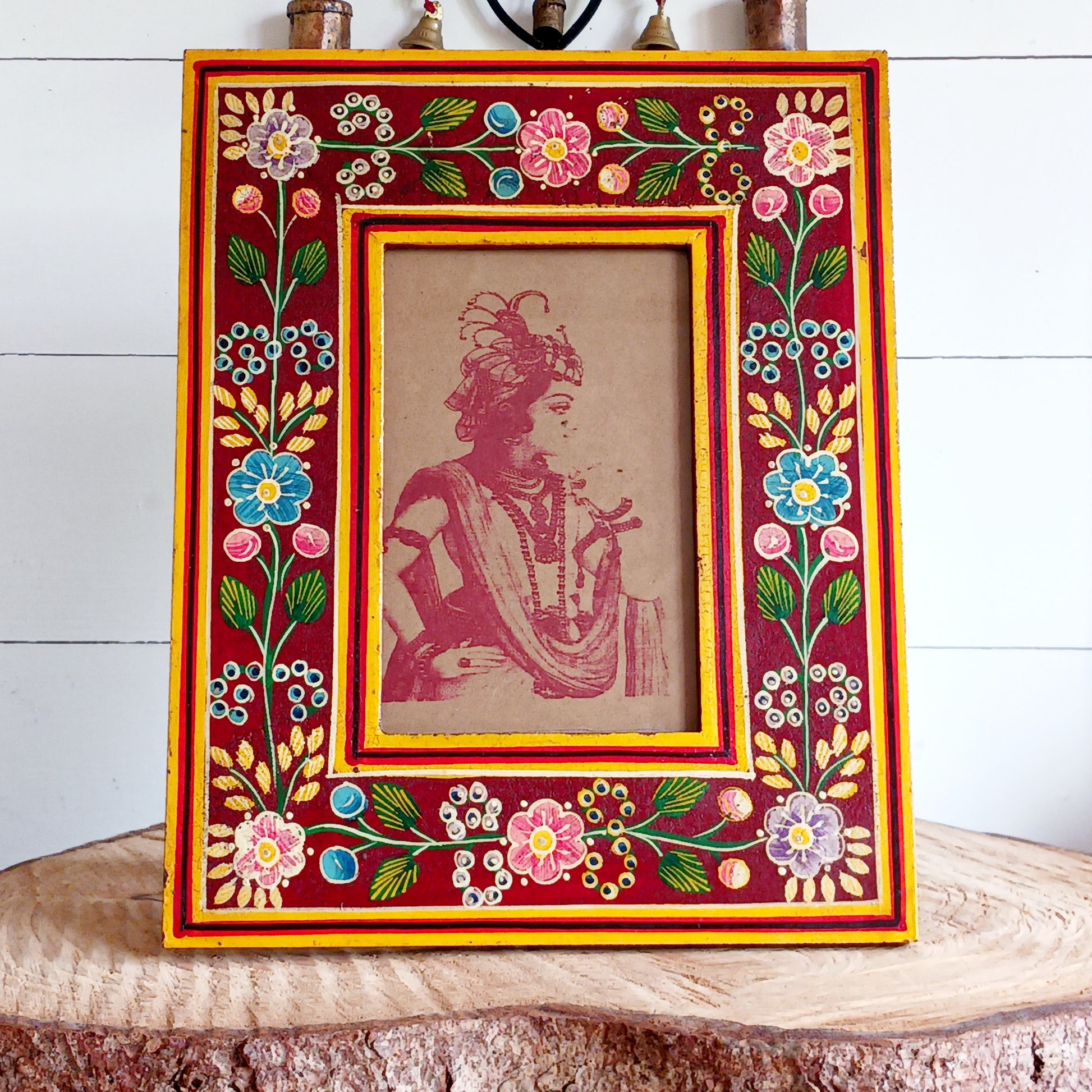 Add a touch of artisan charm to your home with this beautifully handcrafted mango wood photo frame. Made from sustainably sourced mango wood, each frame is carefully hand painted by skilled Indian artisans, featuring vibrant floral patterns that create a stunning tapestry of colour.