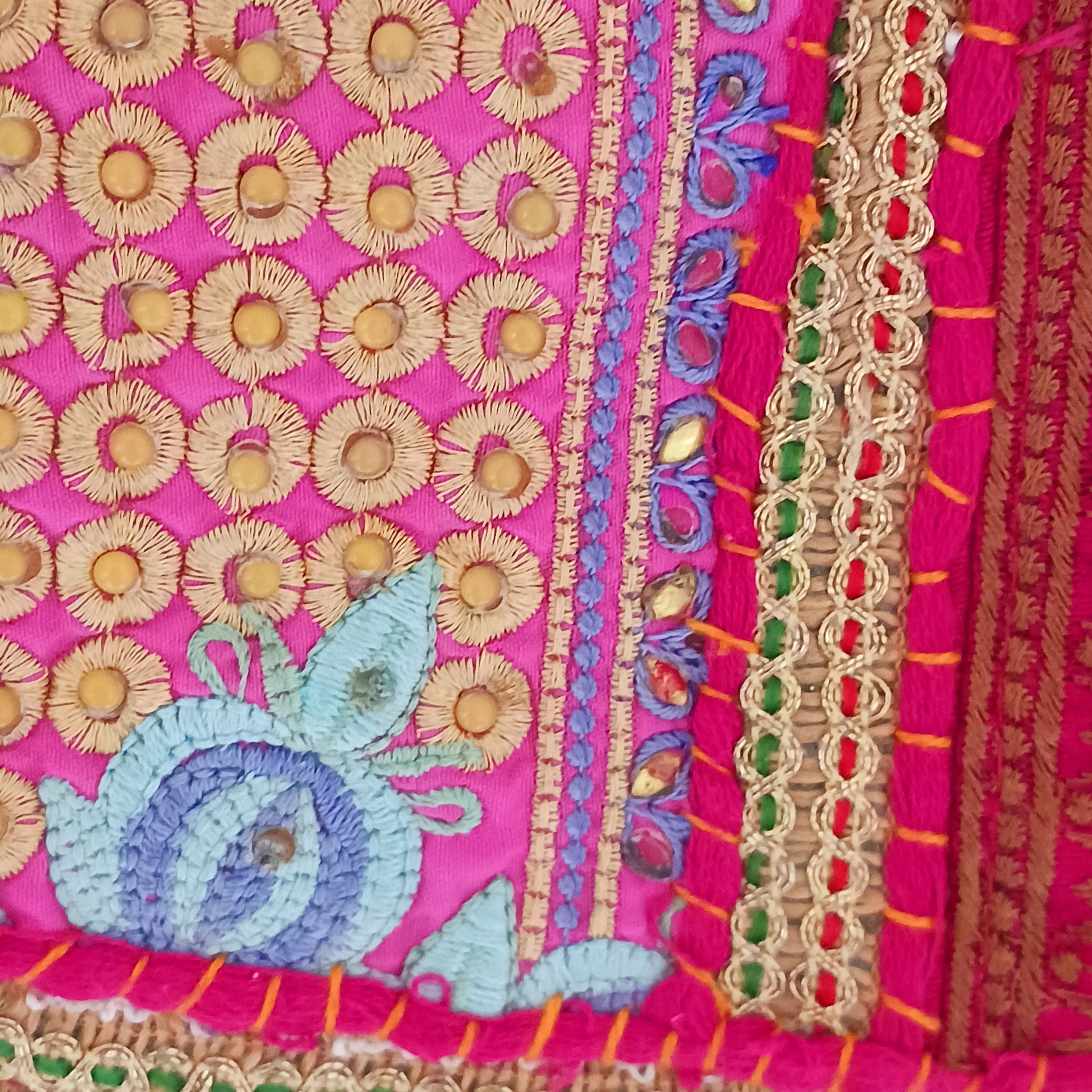 Add a vibrant touch to your everyday style with this beautifully handmade Indian embroidered handbag, crafted from upcycled materials for a truly sustainable fashion statement.
