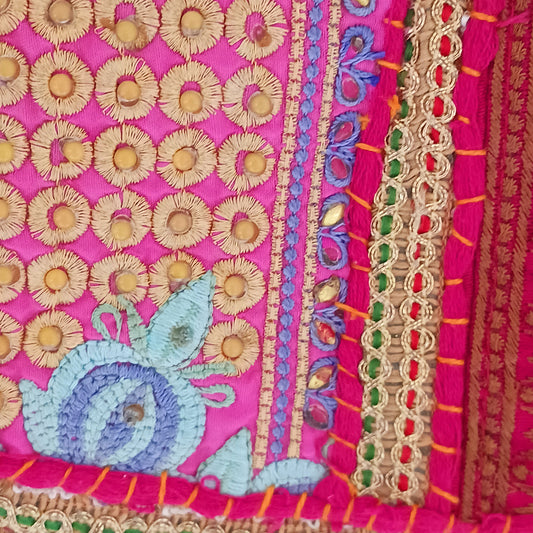 Add a vibrant touch to your everyday style with this beautifully handmade Indian embroidered handbag, crafted from upcycled materials for a truly sustainable fashion statement.