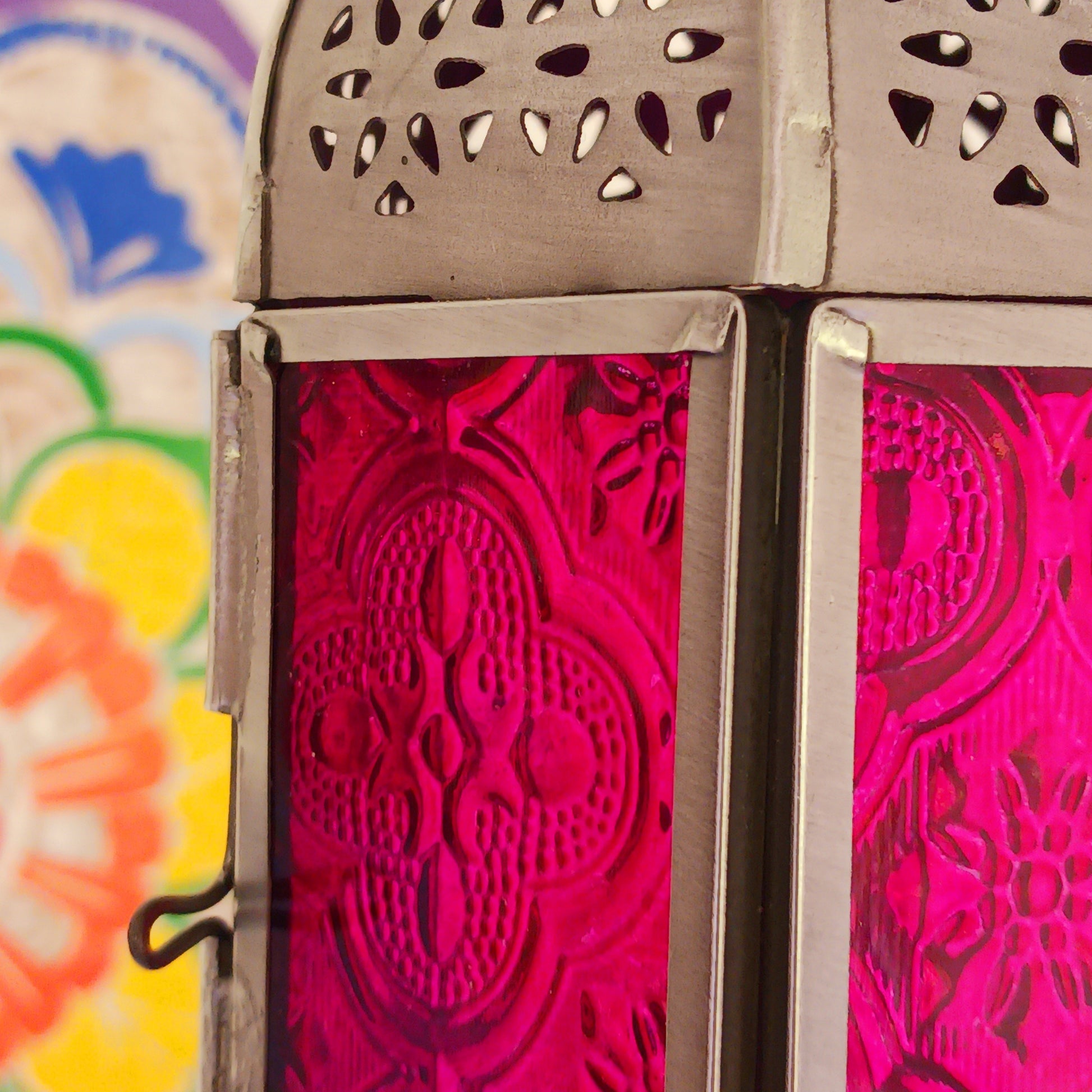 These small glass lanterns come in wonderful colours, featuring an intricate embossed pattern. They have a small hinged door that closes with a sliding catch. The small handle on the top is great for hanging the lanterns around your home. Perfect for adding a touch of warmth to your space.