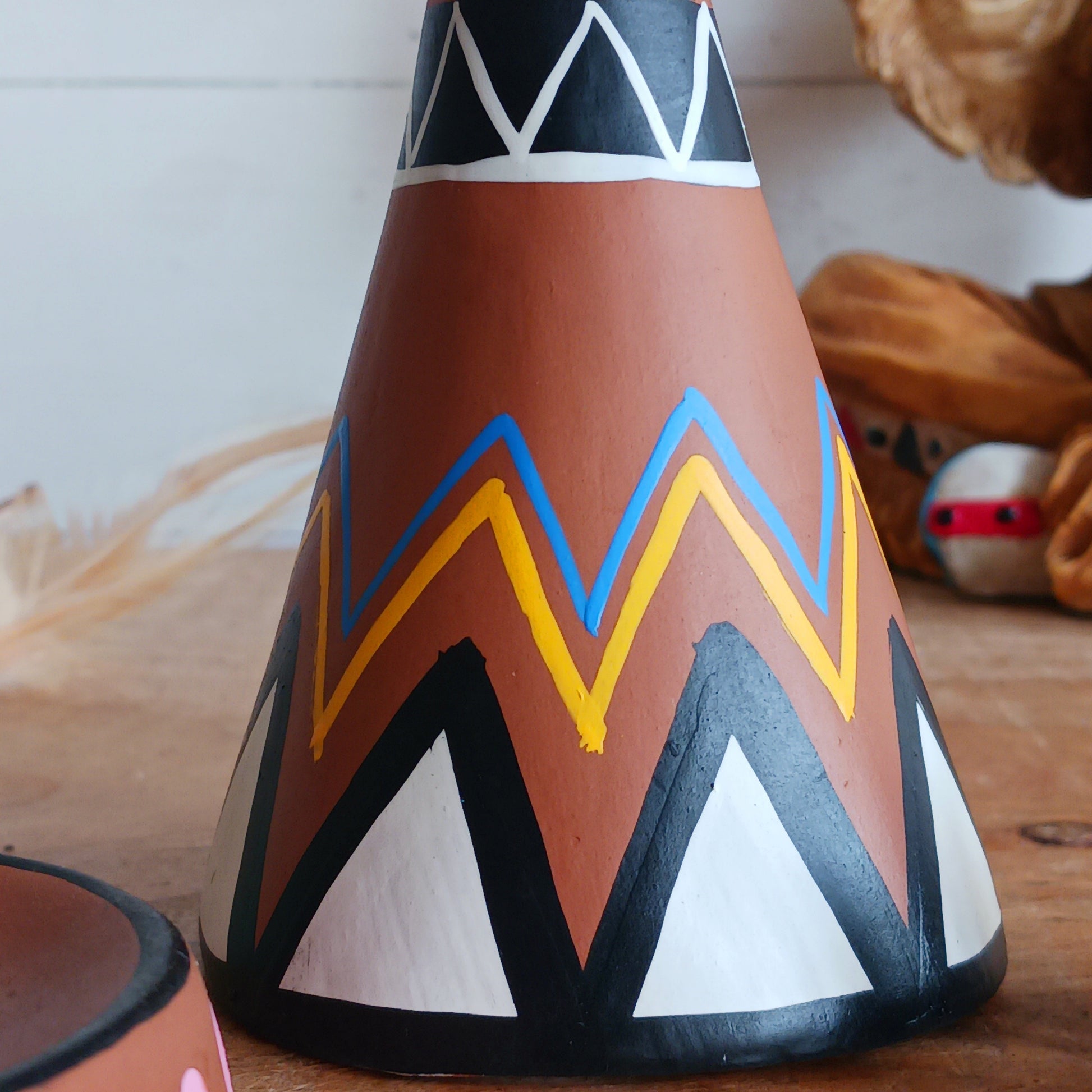 Elevate your incense game with our Clay Tipi Incense Holder.&nbsp;This unique piece has been lovingly handmade and is fairtrade, bringing a touch of charm and authenticity to your home.&nbsp; This quirky tipi design not only catches ash neatly but also adds a playful, earthy vibe to any space. Perfect for meditation, relaxation, or simply creating good vibes and maybe a few smoke signals!