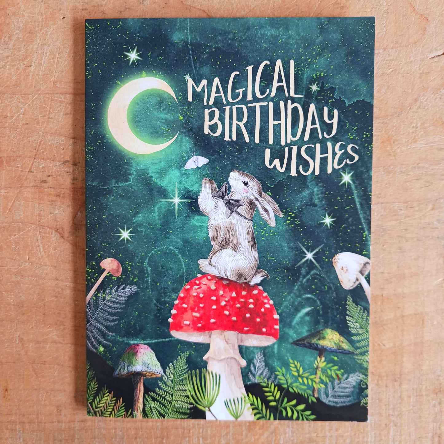 Magical wishes greetings card for birthday. Inside the message reads: May the magic of today last the whole year through!  The card comes with an illustrated envelope. Each card also has faint artwork inside.