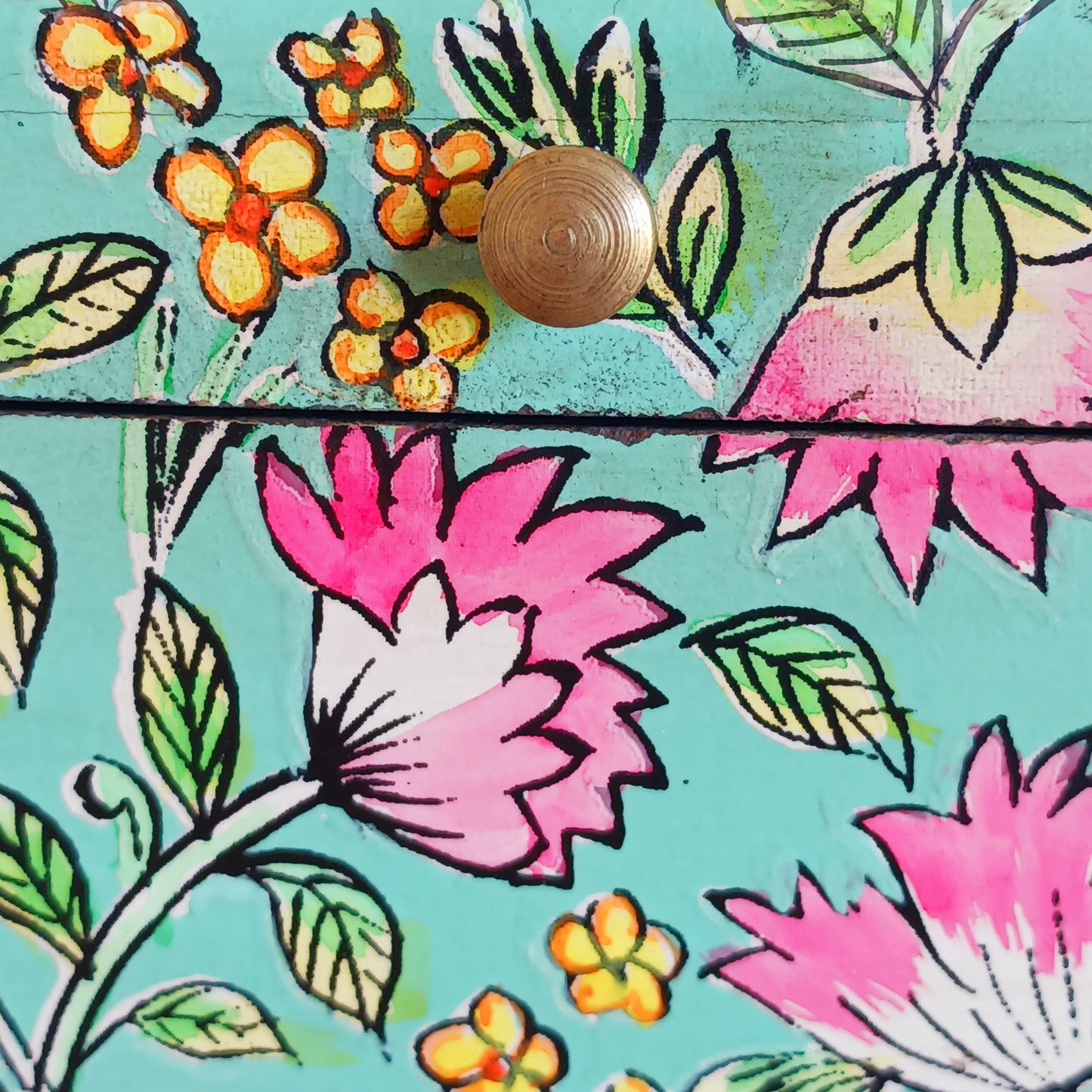 The Saanvi Handcrafted Large Wooden Box is a sustainable gift of beauty, designed to bring charm and practicality to any space. Expertly hand-painted in a bright mixed floral pattern on a pale blue background, this decorative box exudes artisanal elegance. The hinged lid is accented with a small gold-colored knob for a refined touch, while the deep midnight interior offers ample storage for trinkets, jewellery, and cherished keepsakes.