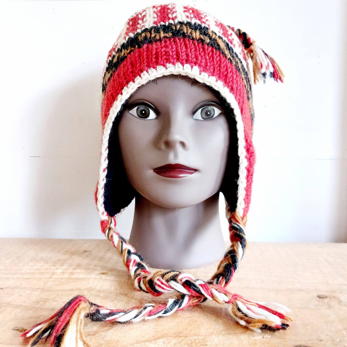 Stay cozy and stylish with our handmade chunky wool earflap hats, crafted in Nepal by skilled women artisans in Kathmandu. Each hat is 100% pure wool and features a soft polar fleece lining for extra warmth and comfort. Perfect for cold winter days, outdoor adventures, or adding a touch of handmade charm to your look.