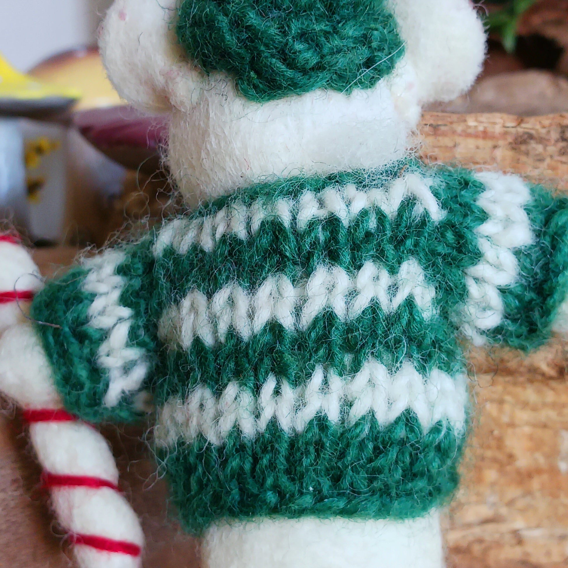 Meet our endearing little Christmas mice, dressed in vibrant elf knitwear, joyfully clutching a felt candy cane ready to spread festive cheer. Each ornament is lovingly handcrafted, capturing the magic and childlike wonder of the holiday season.