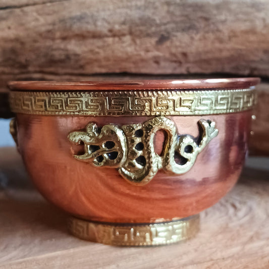 Elevate your spiritual space with this elegant small copper bowl, beautifully engraved with a brass Dragon design. Each piece is handcrafted with care, blending artistry and symbolism for a truly sacred touch. Perfect for rituals, altar offerings, incense burning, or as a unique decorative accent, this bowl radiates warmth through its polished copper glow and detailed brass work. 