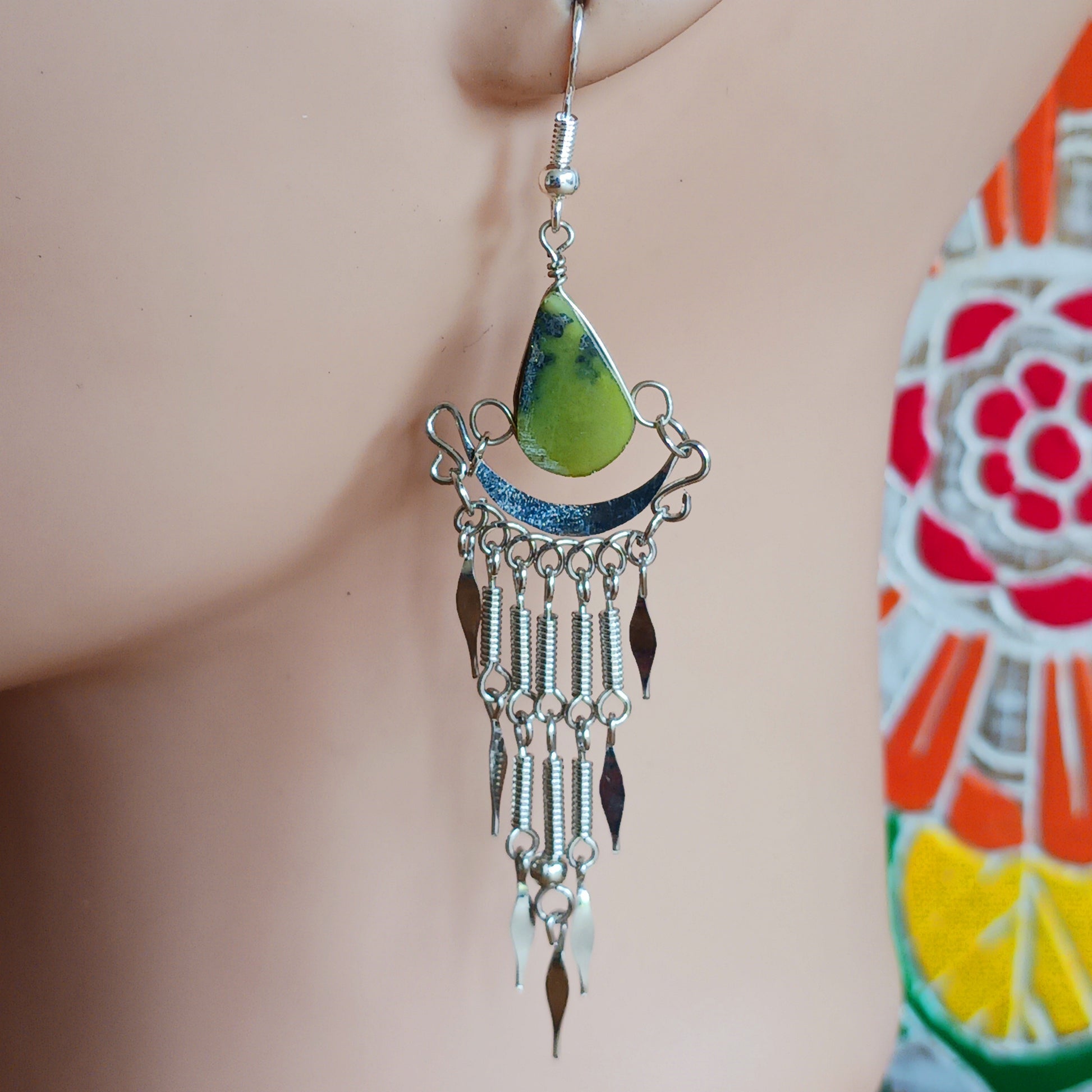 Add a touch of bohemian beauty to your look with these handmade Peruvian stone earrings. Featuring green aventurine stones and finished with silver-plated hooks, each pair is carefully crafted in small workshops in Peru.
