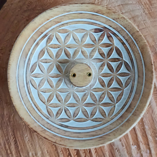 Invite harmony and sacred stillness into your home with this beautifully hand-carved Flower of Life Incense Burner, made from sustainable mango wood. Each piece is crafted with care, featuring the intricate Flower of Life — a sacred geometry pattern symbolizing the interconnectedness of all living things.
