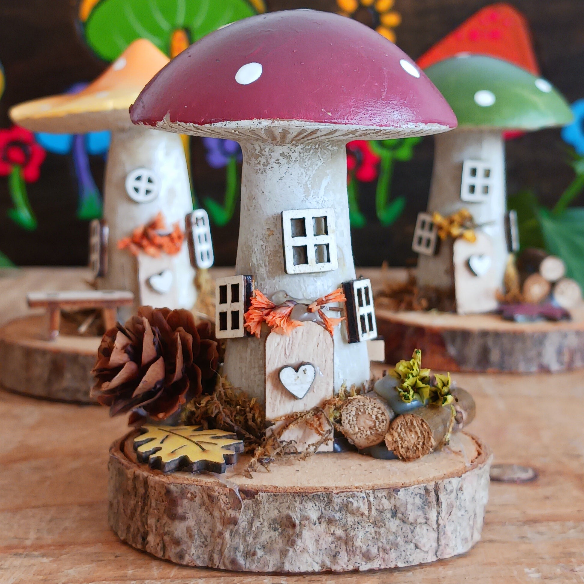Decorative mushroom-shaped house on a wooden base with a colorful background