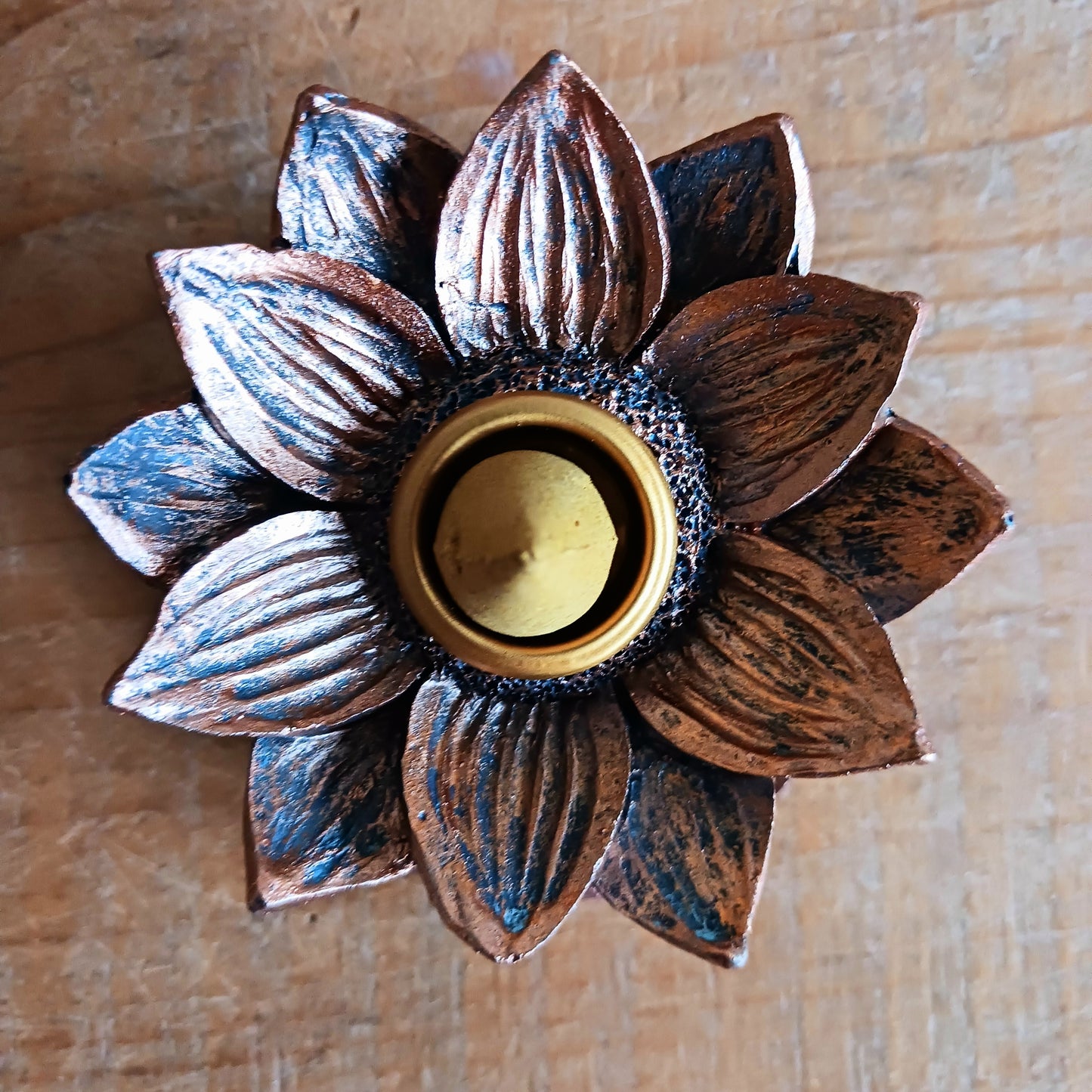 Backflow incense burner in a bronze lotus flower design. When the cone is lit the smoke from the cone cascades downwards in a mesmerizing waterfall effect to pool at the bottom. Beautiful to watch.