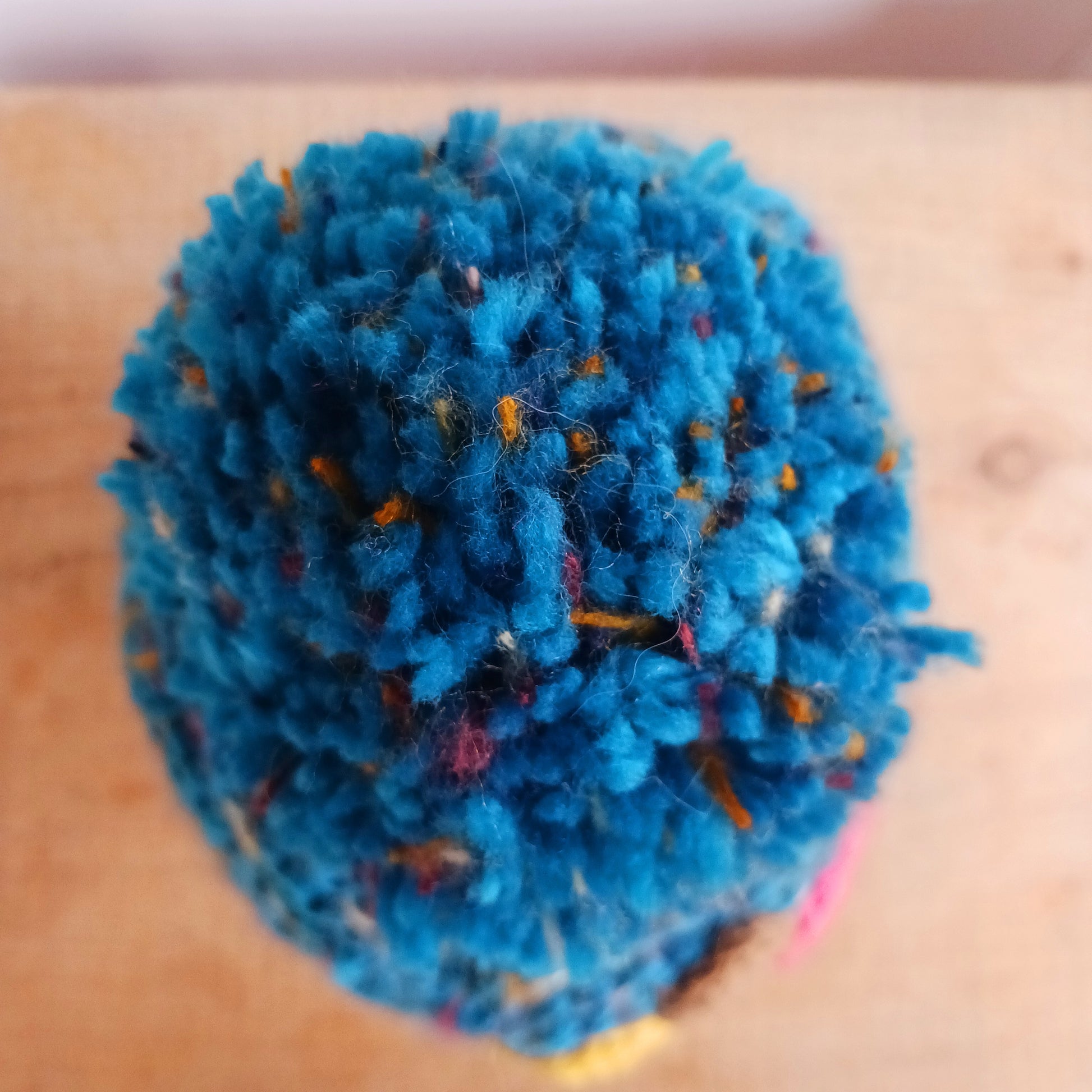 Stay warm in style with this charming knitted wool flower bobble hat, designed to bring both comfort and personality to your winter wardrobe. Crafted from soft, insulating wool, this cozy beanie keeps you snug even on the coldest days.