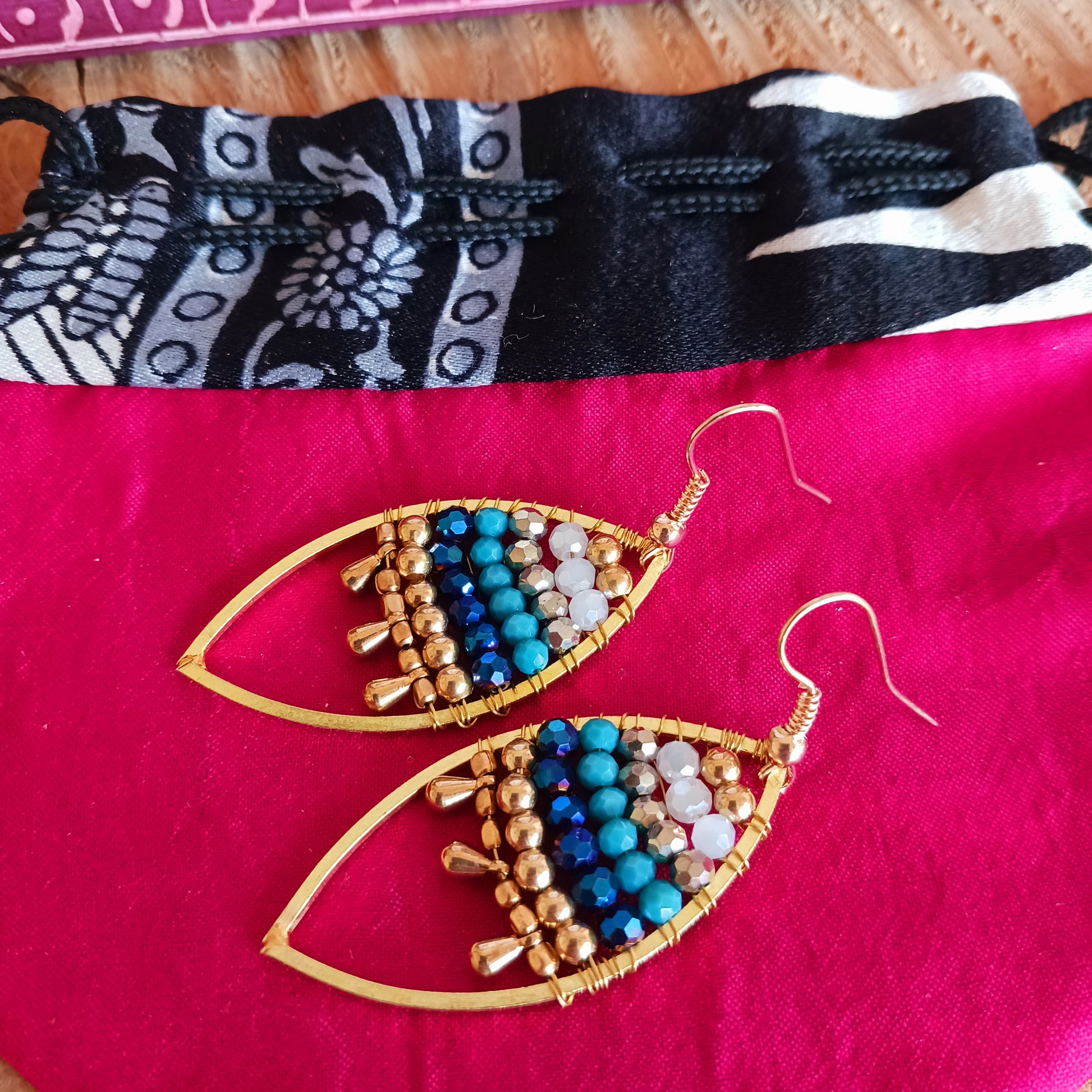 These pretty beaded earrings are so bohemian chic and add effortless style to your outfit. The beads sparkle gently when the light catches them, making them a great evening accessory as well as daytime. They are finished with gold plated hooks.