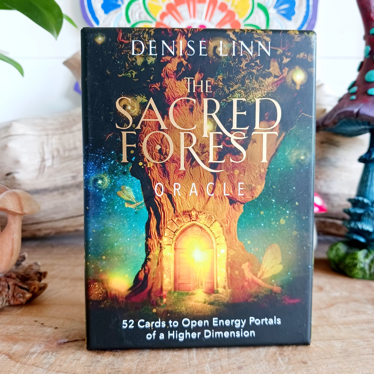 The Sacred Forest Oracle card deck by Denise Linn includes a 52-card deck and 144 page guidebook. This deck opens the user's inner self to expand and enlighten their spiritual journey. Beautifully presented in a matching box.