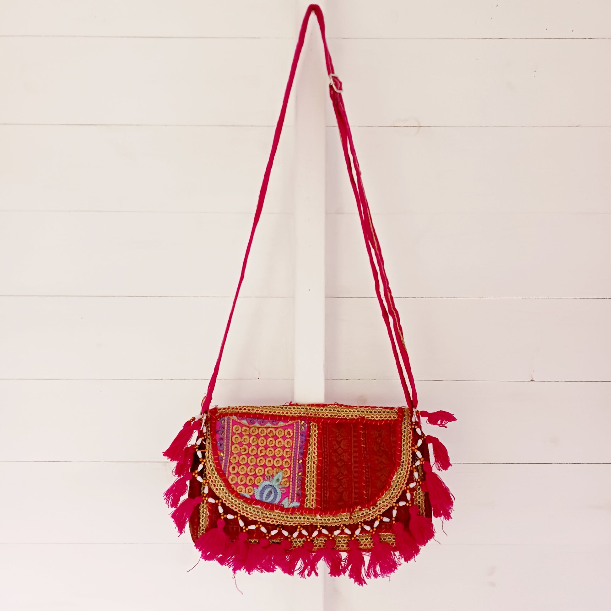 Add a vibrant touch to your everyday style with this beautifully handmade Indian embroidered handbag, crafted from upcycled materials for a truly sustainable fashion statement.