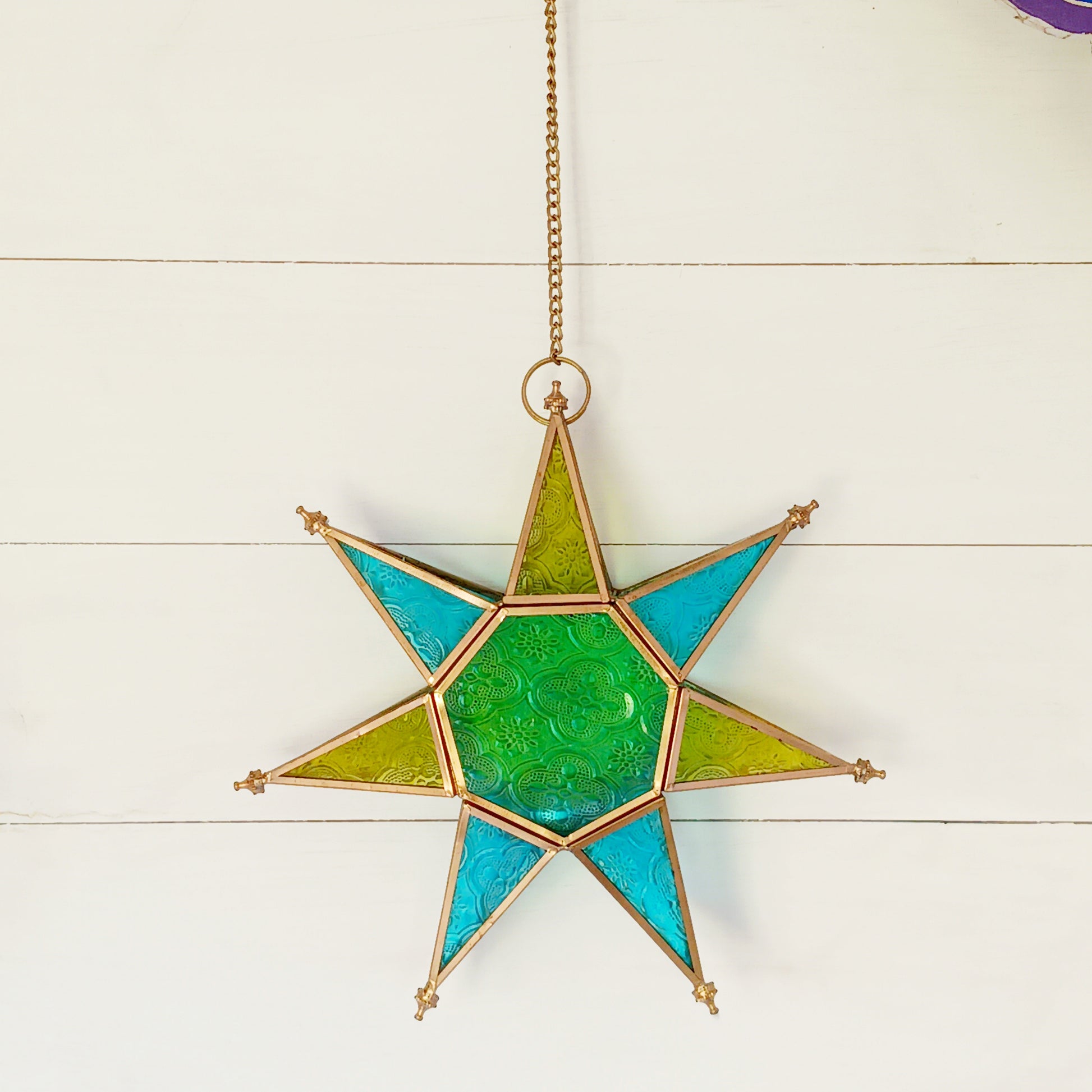 These Moroccan style star glass lanterns are handcrafted by skilled artisans and come in beautiful rich colours that catch the eye and instantly add atmosphere to any room.