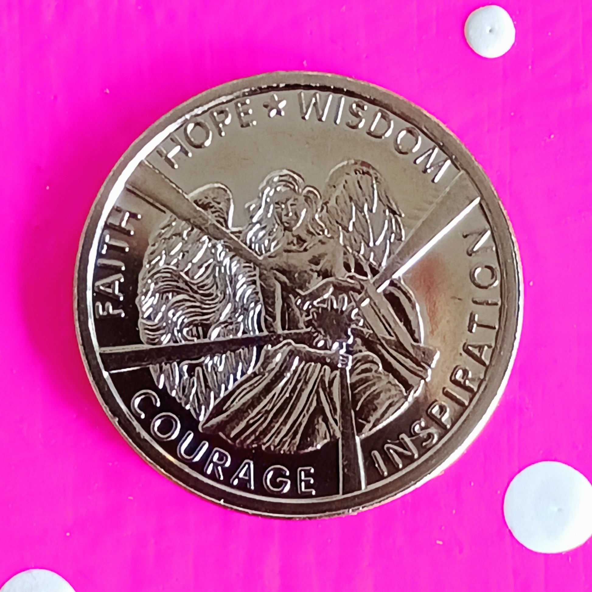 A beautiful Angel of Light adorns the front of this coin, with the words Hope - Wisdom - Inspiration - Courage - Faith. The back features a guardian angel with the message ‘Reach for the Stars’.