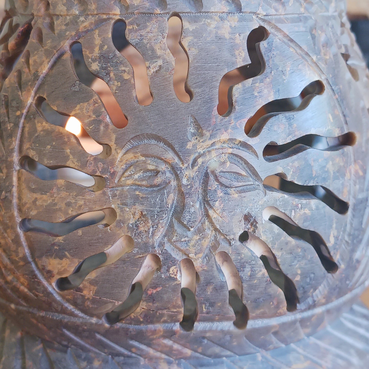 Enhance your home with calming fragrance and natural style with this beautifully carved soapstone oil burner. Featuring an elegant central sun motif with detailed leaf designs, this decorative aromatherapy burner adds warmth, ambience, and relaxing scent to any room.