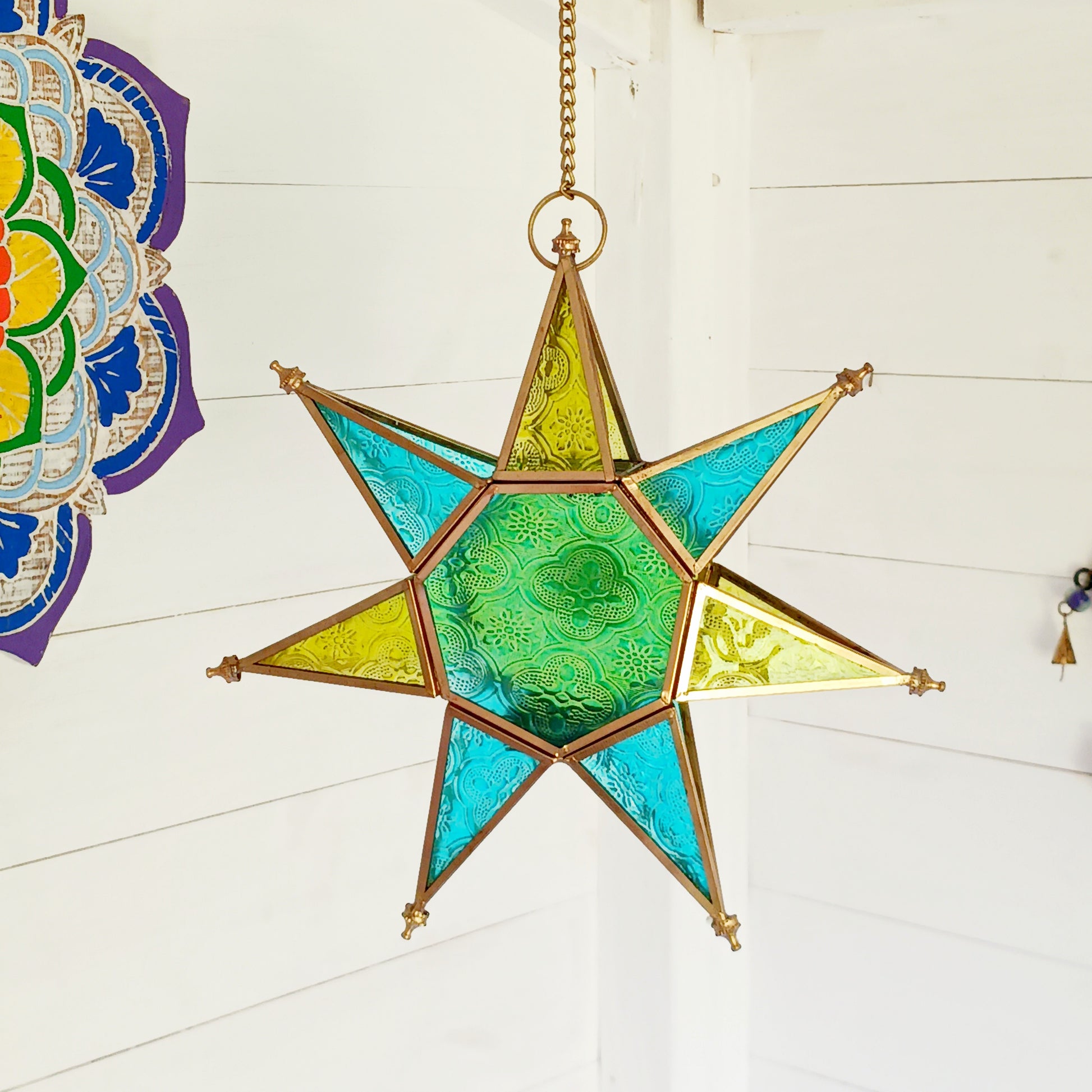 These Moroccan style star glass lanterns are handcrafted by skilled artisans and come in beautiful rich colours that catch the eye and instantly add atmosphere to any room.