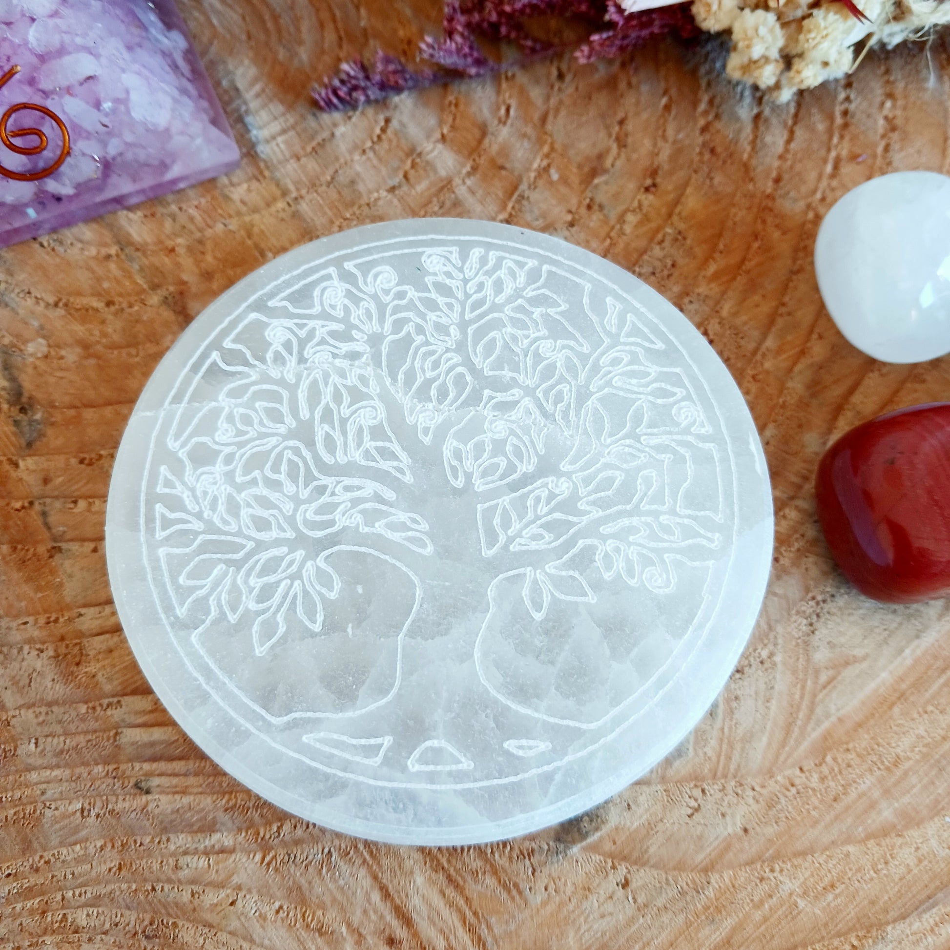 This crystal charging plate is a beautiful and functional accessory for any crystal lover. Measuring 8cm in diameter, this charging plate is made from natural selenite, which is known for its cleansing and charging properties.