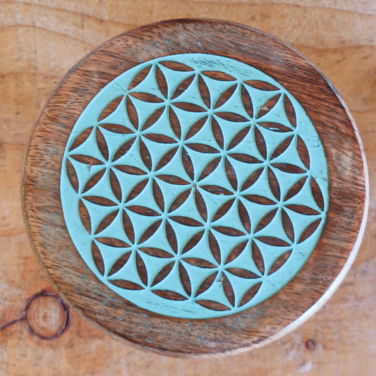Bring the beauty of sacred geometry into your space with these compact Flower of Life tables. Handcrafted from solid mango wood, each table features a finely engraved Flower of Life symbol on top – an ancient pattern representing the interconnectedness of all life. 