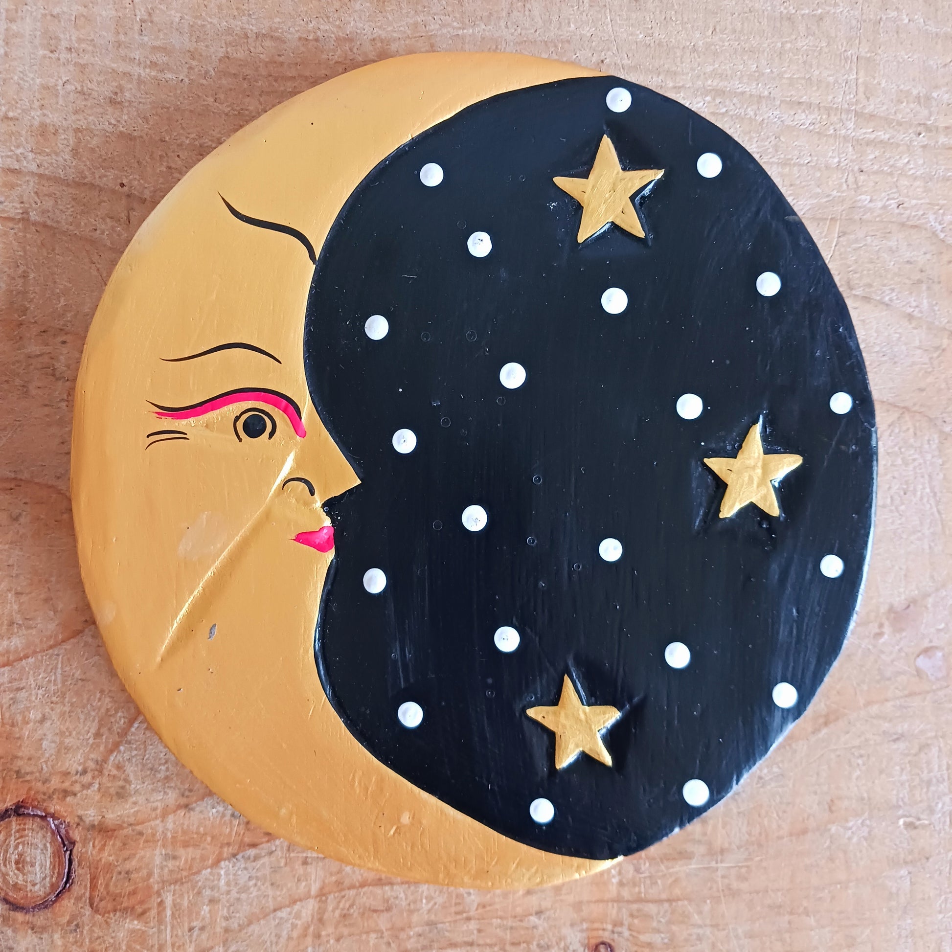 Bring celestial charm and mystical elegance into your space with this Black and Gold Moon Plaque. Hand-carved by skilled Balinese artisans from sustainably sourced wood, this stunning wall piece pairs the gentle energy of the moon with a dramatic black and gold colour palette.