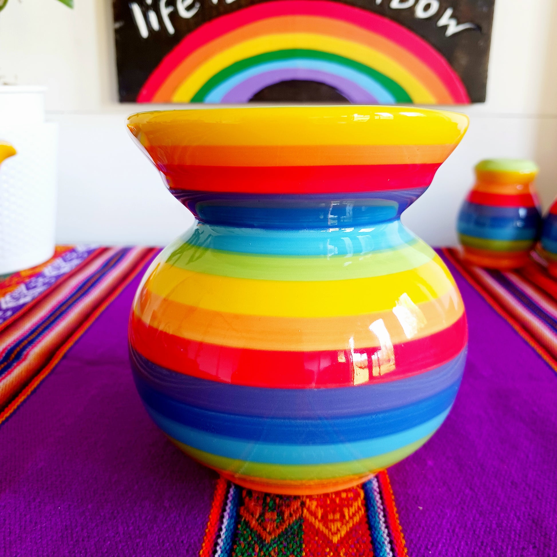 Wonderfully cheerful rainbow stripe ceramic oil burner. The vibrant stripes are hand painted giving each piece individual character.