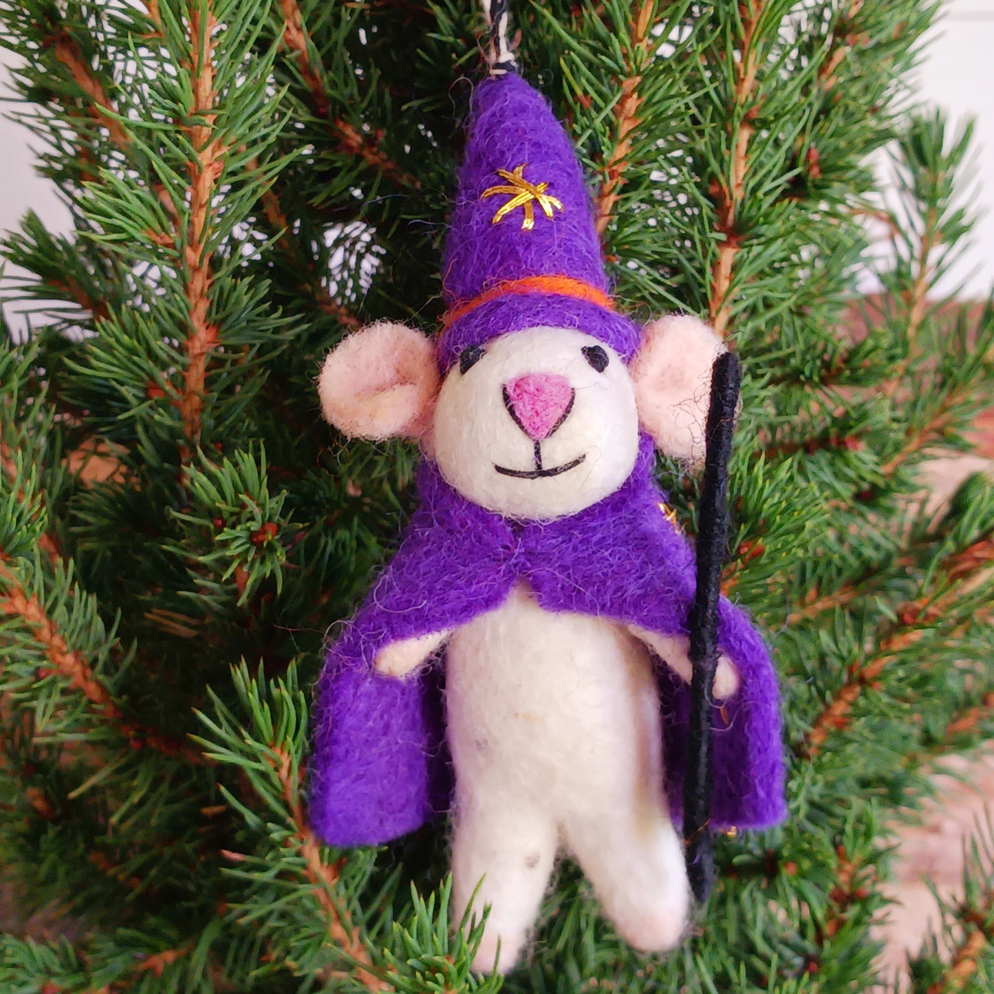 Bring a touch of handcrafted Halloween charm to your home with these delightful felted mice dressed as a Wizard character. Each mouse features adorable details including long tails, soft pink ears and noses, and colourful pointed hats and capes. The Wizard style is elegantly finished with gold star embroidery for extra magical flair.