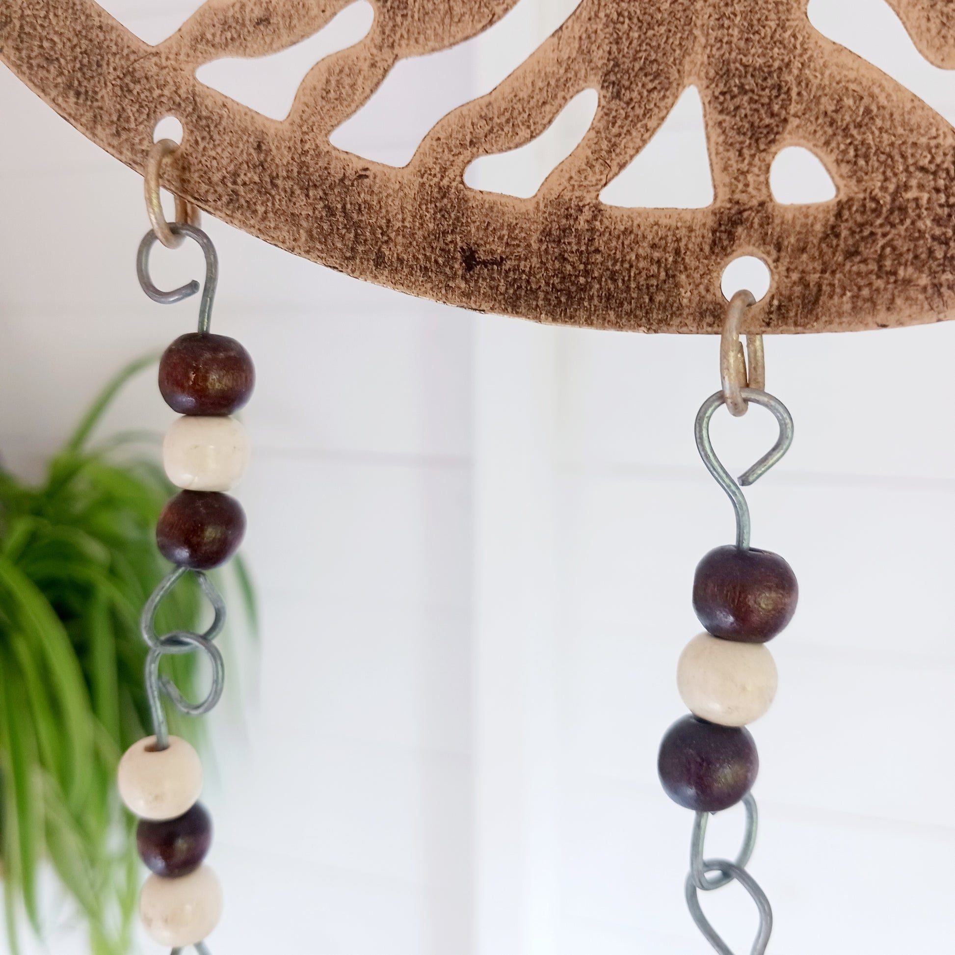 Bring the timeless symbolism of the Tree of Life to your home with this beautiful Tree of Life windchime.  Made in India from quality brass, this 25 cm chime features a beautifully detailed Tree of Life design, adorned with Indian beads. Each branch of the tree is a reminder of growth, connection, and harmony, while the soothing sounds of the bells offer peace to any space.