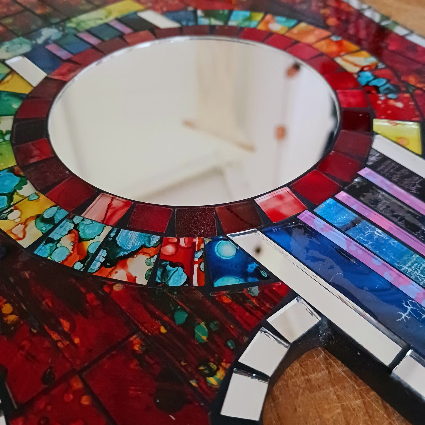 Handcrafted from shimmering, individually placed glass tiles, this stunning guitar-shaped glass mosaic mirror blends creativity, rhythm, and craftsmanship into one striking wall décor accent.