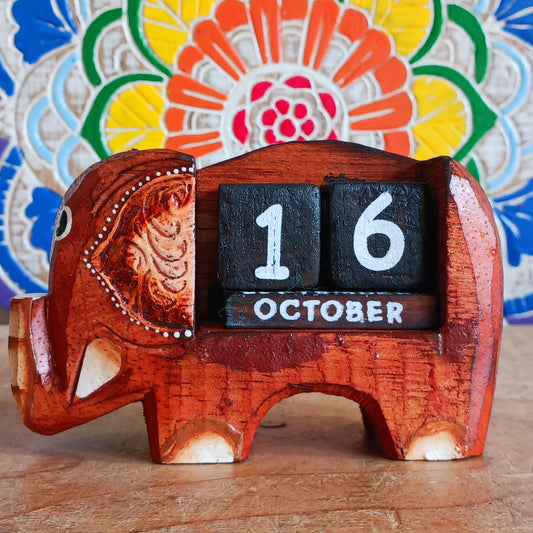 Brighten up your desk with this charming hand-painted wooden elephant calendar! This cheerful desk-buddy is both practical and eco-friendly, making it a perfect addition to your work or study space. Simply rotate the wooden blocks each day to keep track of the date – no need to replace it year after year. A thoughtful, sustainable gift for elephant lovers, students, or anyone who enjoys unique handcrafted décor.