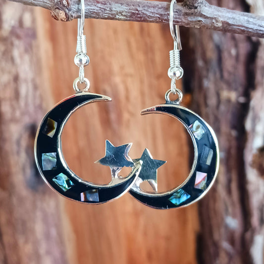 These lovely abalone Mexican earrings are crafted to show a moon and stars design. Our Mexican earrings are produced by hand in the picturesque town of Taxco using sustainable abalone shell.