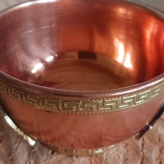 Elevate your spiritual space with this elegant small copper bowl, beautifully engraved with a brass Dragon design. Each piece is handcrafted with care, blending artistry and symbolism for a truly sacred touch. Perfect for rituals, altar offerings, incense burning, or as a unique decorative accent, this bowl radiates warmth through its polished copper glow and detailed brass work. 