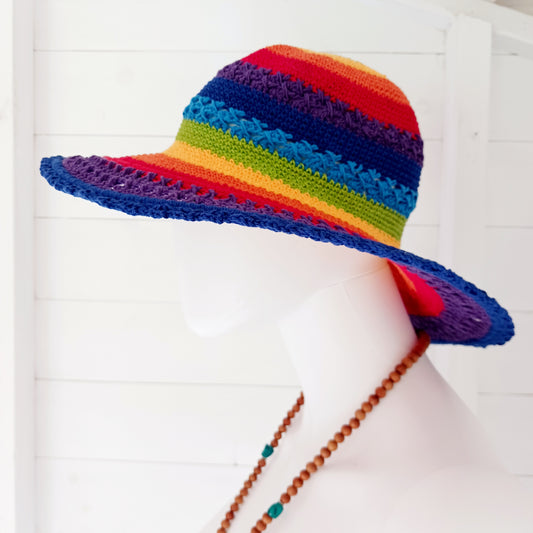 Handmade rainbow crochet sun hat with a flexible brim. Perfect for holidays, beach days & festivals. Unique, lightweight, and ready for sunny adventures!