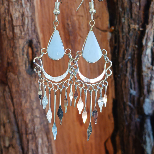 These beautiful earrings incorporate a pale blue stone with Silver plated hooks. They earrings have been hand made in Peru and are presented in a traditionally made pouch gift wrapped and ready to give ☸
