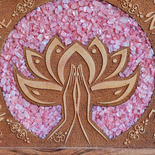 Keep your cherished items safe in this beautifully crafted mango wood jewellery box, engraved with the word ‘Namaste’. A Sanskrit greeting meaning “the divine in me greets the divine in you,” it serves as a daily reminder of connection, presence, and mutual respect. Accented with rose quartz—symbolizing love, compassion, and emotional healing—this box is ideal for storing jewellery, keepsakes, cards, or other personal treasures. Subtle, spiritual, and thoughtful, it’s a meaningful addition to any space.