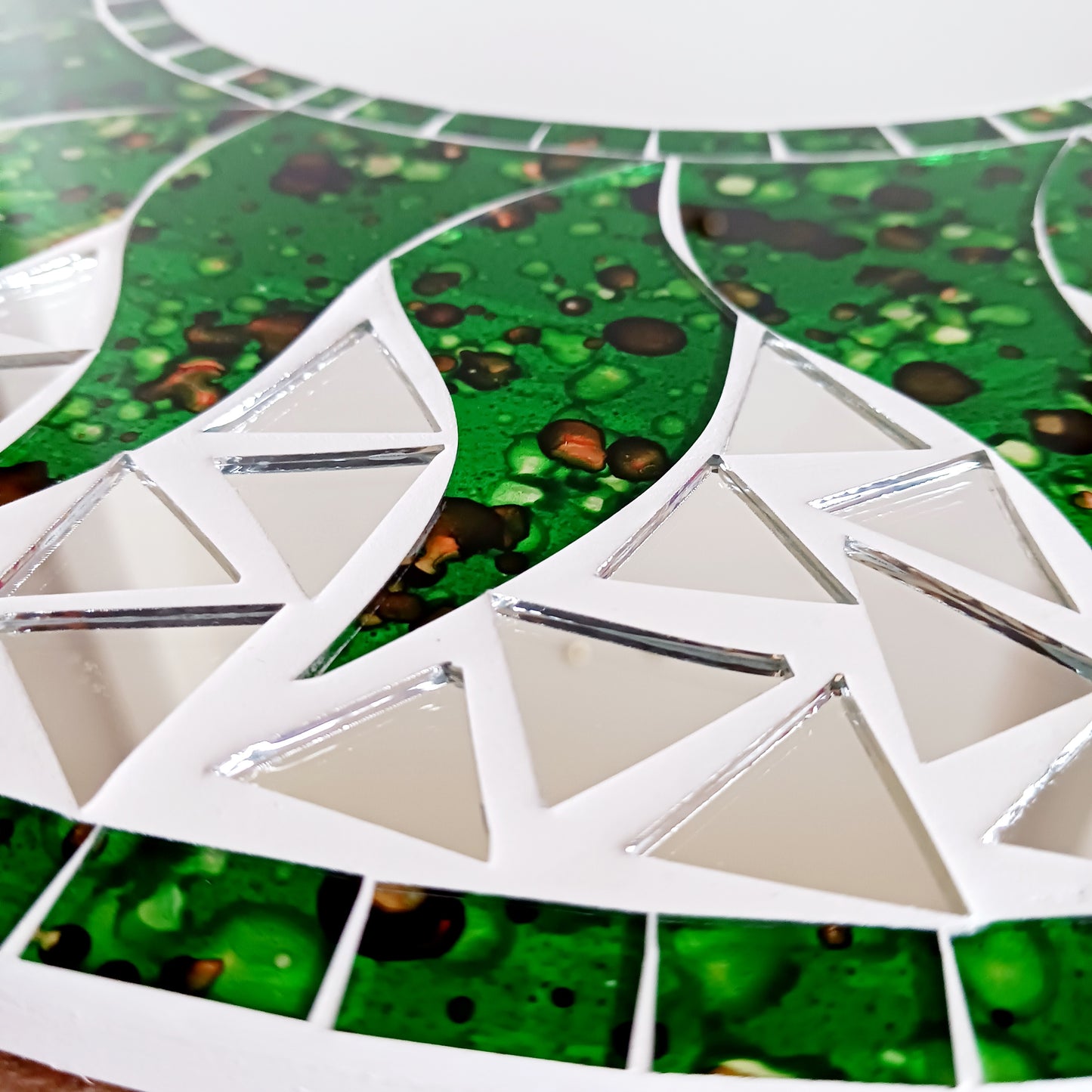 Add warmth, energy, and artistic charm to your home with this beautiful Vibrant Green Mosaic Sun Mirror. Designed with dazzling green mosaic tiles arranged in a radiant sunburst pattern, this captivating wall accent instantly brightens any room.