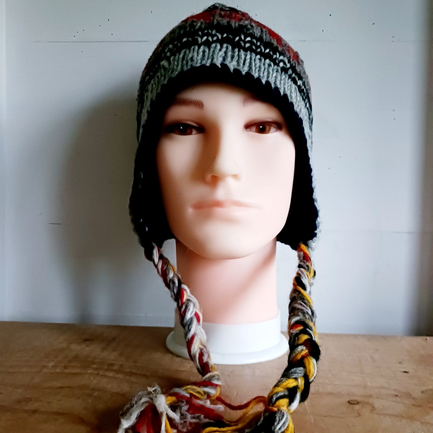 Stay cozy and stylish with our handmade chunky wool earflap hats, crafted in Nepal by skilled women artisans in Kathmandu. Each hat is 100% pure wool and features a soft polar fleece lining for extra warmth and comfort. Perfect for cold winter days, outdoor adventures, or adding a touch of handmade charm to your look.