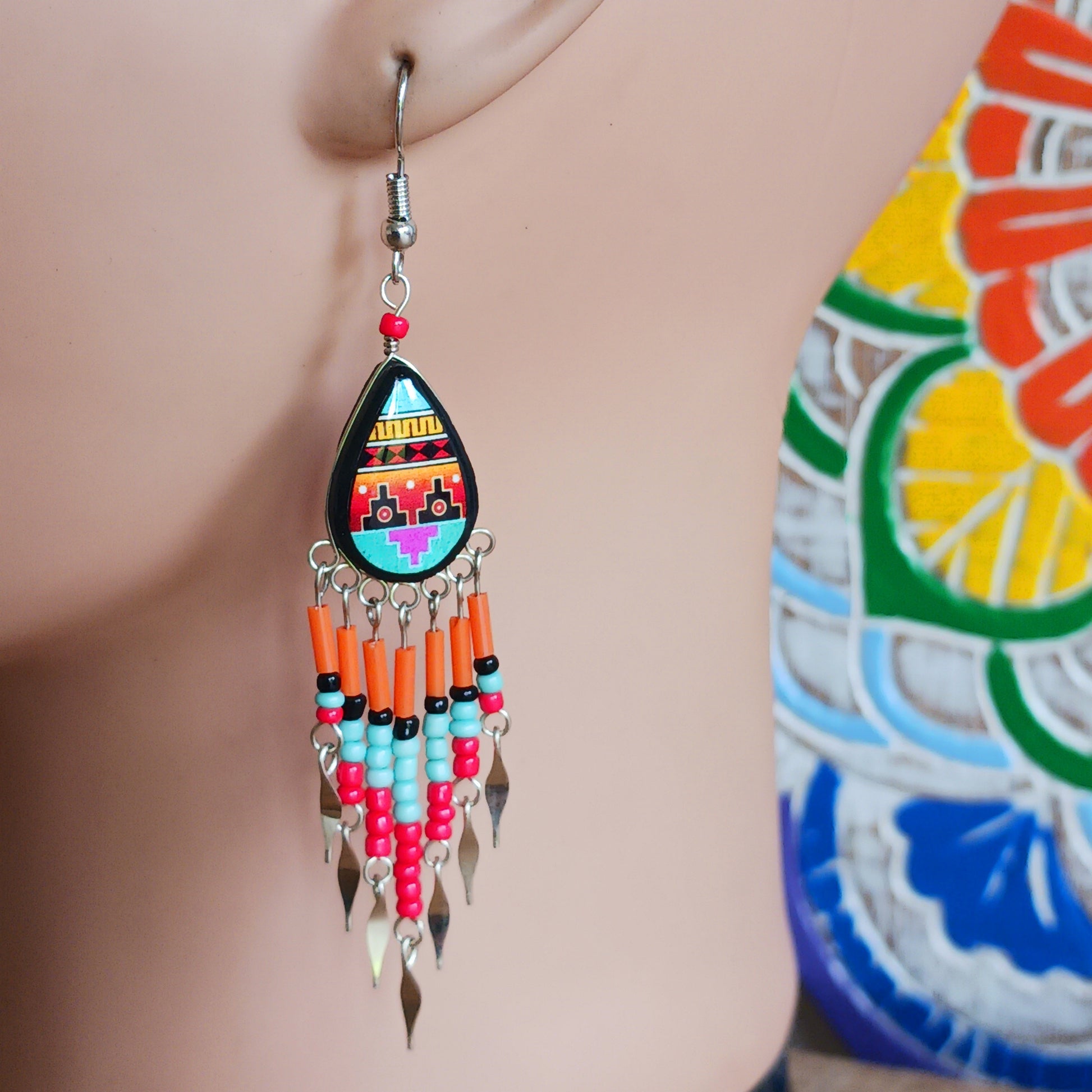 Add a touch of artisan elegance to your jewellery collection with these stunning handmade Peruvian Incan teardrop earrings. Carefully crafted in small family-run workshops in Peru, these eye-catching earrings feature traditional Incan-inspired patterns on the front with a contrasting black reverse for a striking finish.