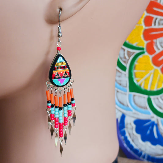 Add a touch of artisan elegance to your jewellery collection with these stunning handmade Peruvian Incan teardrop earrings. Carefully crafted in small family-run workshops in Peru, these eye-catching earrings feature traditional Incan-inspired patterns on the front with a contrasting black reverse for a striking finish.