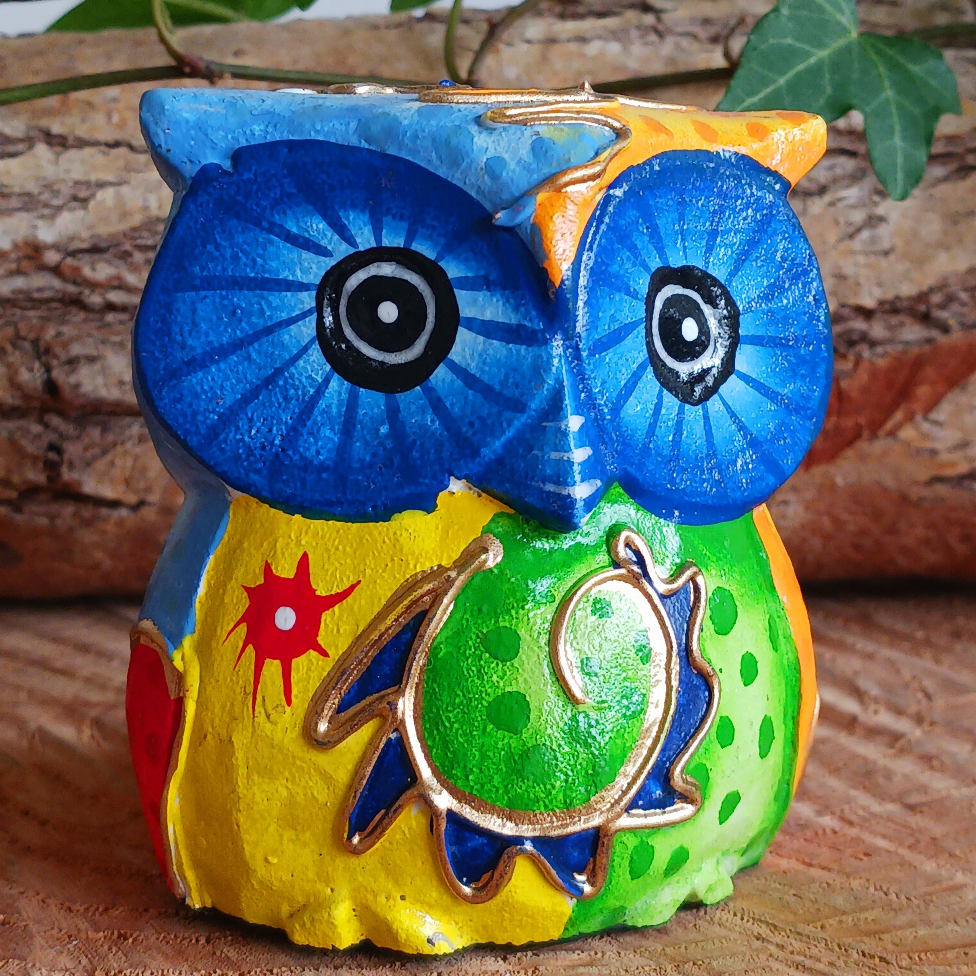 Add a pop of colour to your home décor with these beautifully hand painted Psychedelic Owls. These vibrant and quirky owl figurines instantly brighten any room with their playful charm.