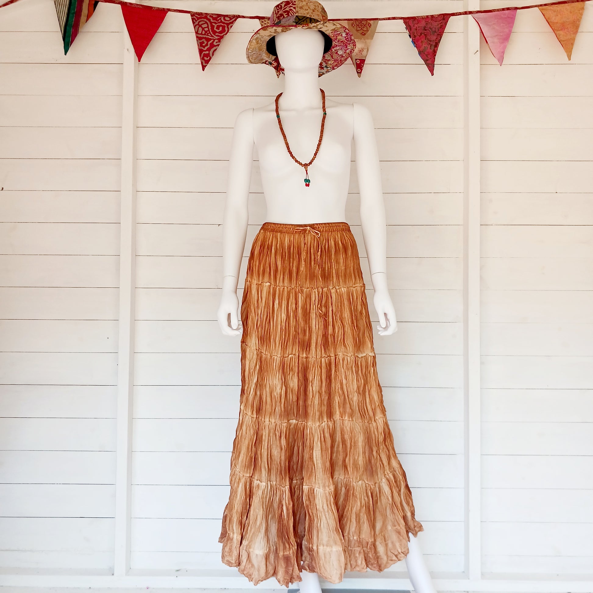 This beautiful Indian crinkle skirt is lovely and light so you can move with ease and comfort on a sunny day or a hot night. Made from rayon crepe, you can’t go wrong with this lovely skirt, it will add to your flowing summer style. And as rayon is quick drying, it also makes this a great beach cover up skirt.