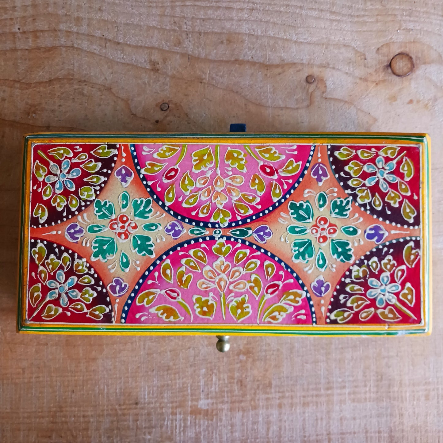 Add charm and colour to your space with this beautifully handmade and hand-painted wooden jewellery box featuring a vibrant lime and floral pattern.